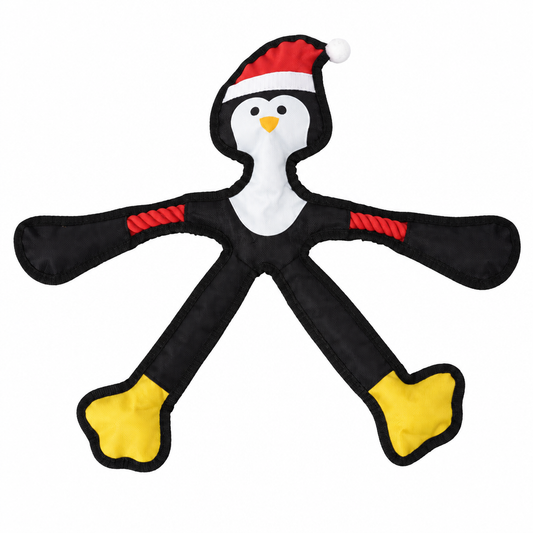French Bulldog playing with NEXORA flat plush penguin toy on stairs